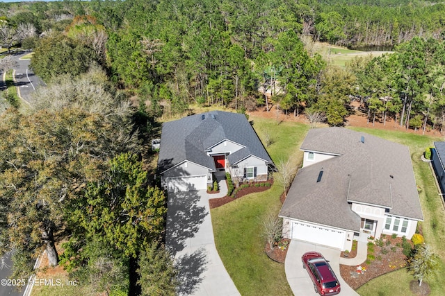 bird's eye view featuring a forest view