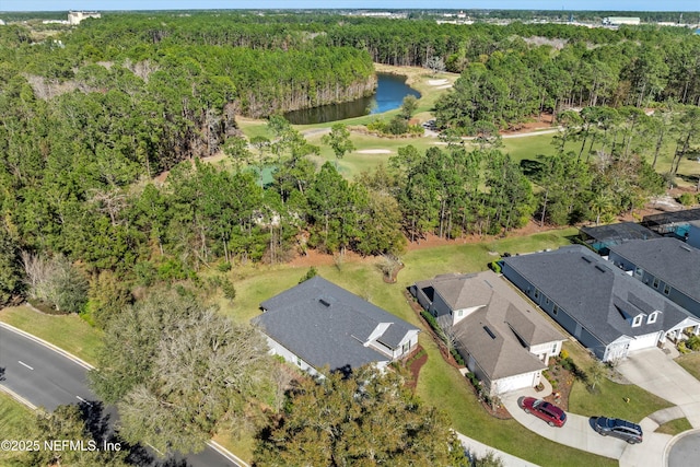 aerial view with a water view, a residential view, and a view of trees