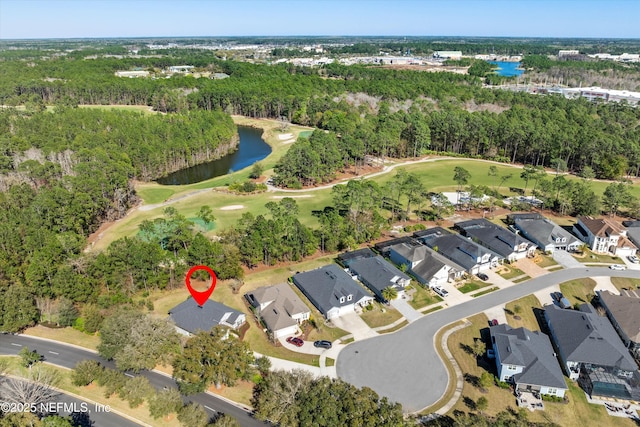 birds eye view of property featuring a residential view, a water view, a view of trees, and golf course view