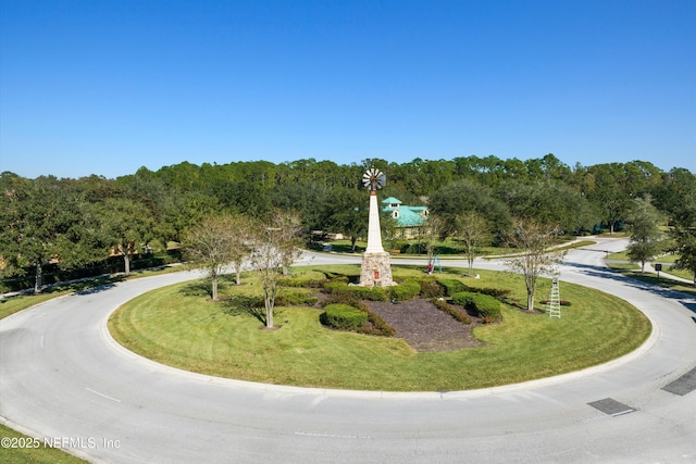 view of home's community featuring a yard