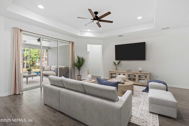 210 Greenview Ln, Saint Augustine, FL 32092 - living area featuring a tray ceiling, dark wood finished floors, a ceiling fan, baseboards, and recessed lighting
