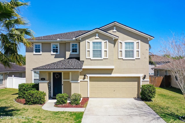 traditional-style home with stucco siding, an attached garage, concrete driveway, and fence