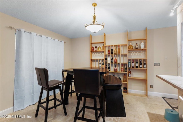 dining room with baseboards