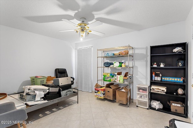 office with a textured ceiling and a ceiling fan