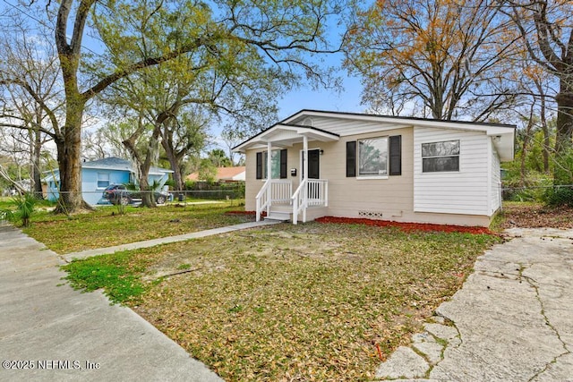 bungalow with crawl space, fence private yard, and a front yard