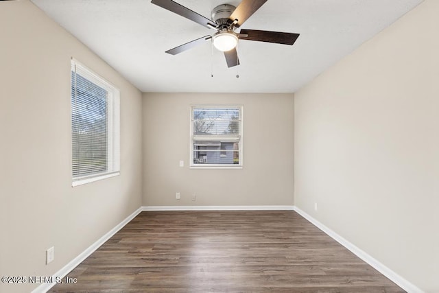 empty room featuring ceiling fan, wood finished floors, and baseboards