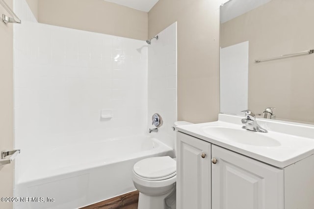 full bathroom featuring toilet, bathing tub / shower combination, and vanity