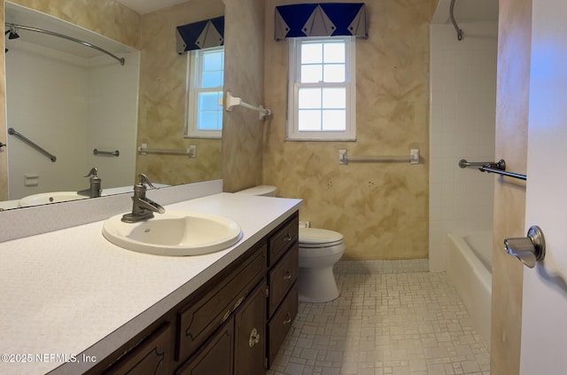 bathroom with toilet, shower / bathtub combination, and vanity