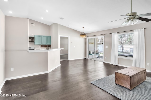 unfurnished living room featuring baseboards, lofted ceiling, a ceiling fan, and dark wood-style flooring