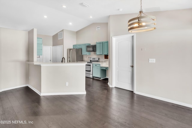 kitchen featuring visible vents, light countertops, lofted ceiling, appliances with stainless steel finishes, and a peninsula