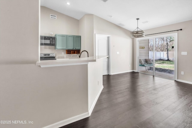 kitchen with dark wood finished floors, stainless steel electric stove, black microwave, and vaulted ceiling