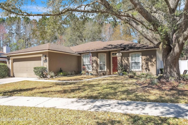 ranch-style house with stucco siding, an attached garage, concrete driveway, and a front yard