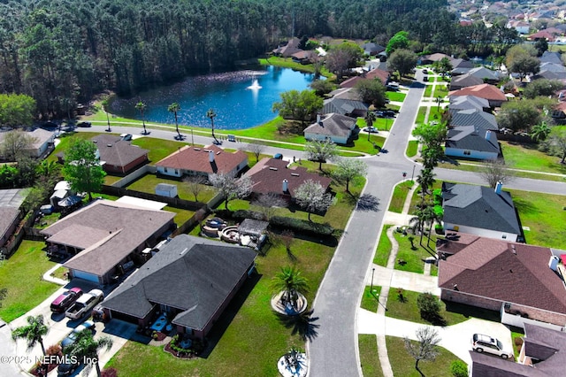 bird's eye view with a residential view and a water view