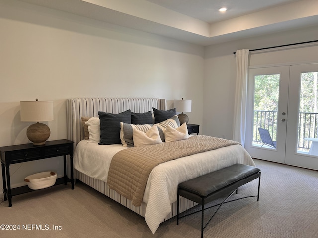 bedroom featuring light carpet, access to outside, french doors, and multiple windows