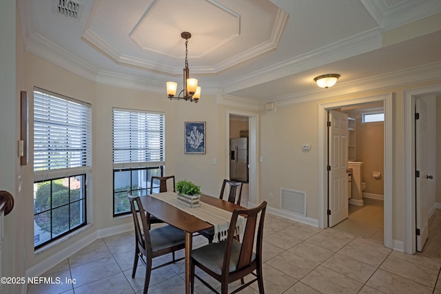 dining room with an inviting chandelier, visible vents, crown molding, and light tile patterned flooring