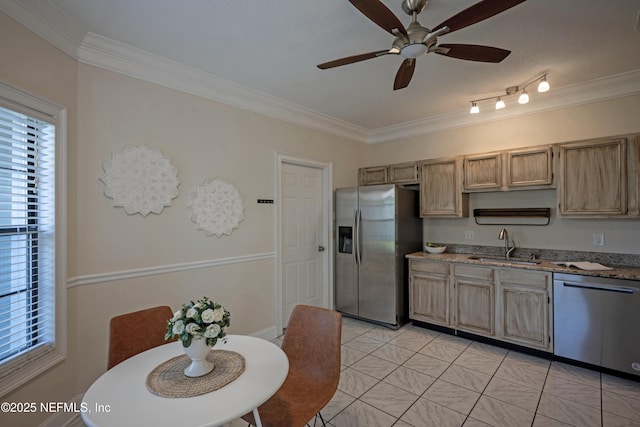 kitchen featuring a sink, a ceiling fan, appliances with stainless steel finishes, light stone countertops, and crown molding