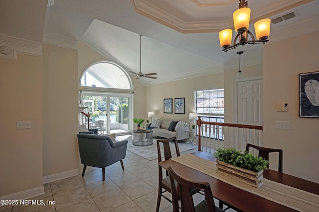 dining area with ornamental molding, a wealth of natural light, visible vents, and light tile patterned floors