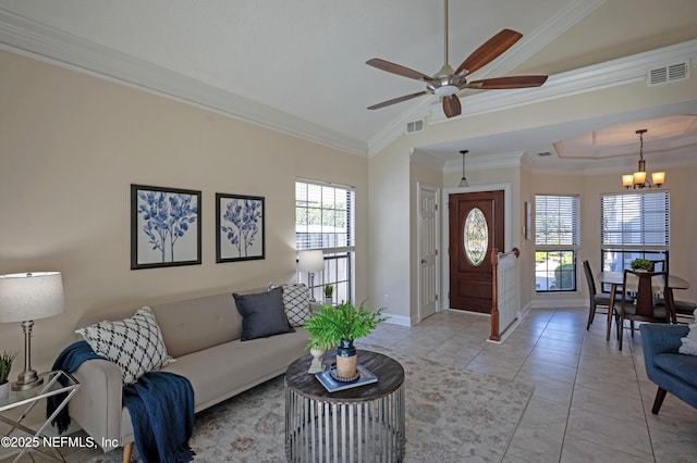 living area featuring light tile patterned flooring, baseboards, visible vents, and ornamental molding