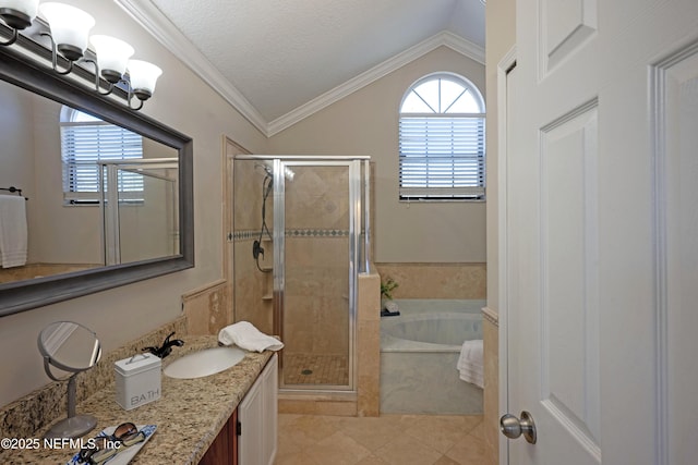 full bath with lofted ceiling, a garden tub, a sink, ornamental molding, and a shower stall