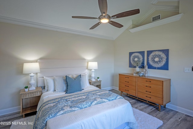 bedroom featuring baseboards, visible vents, wood finished floors, and ornamental molding