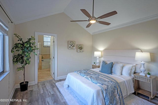 bedroom with lofted ceiling, light wood finished floors, baseboards, and ornamental molding