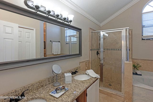 bathroom featuring a stall shower, crown molding, and a sink