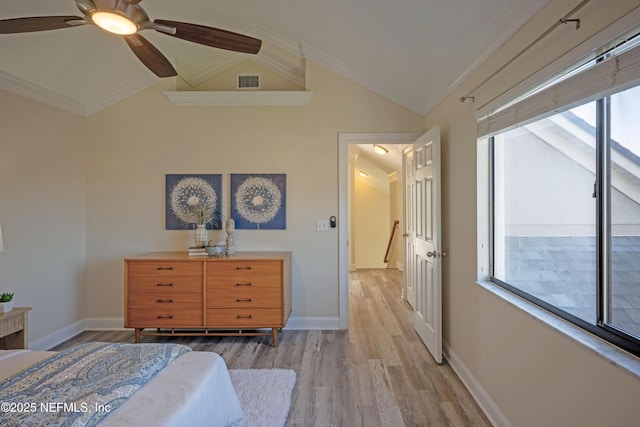 unfurnished bedroom featuring lofted ceiling, light wood-style floors, visible vents, and crown molding