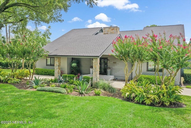 view of front of home with a front yard