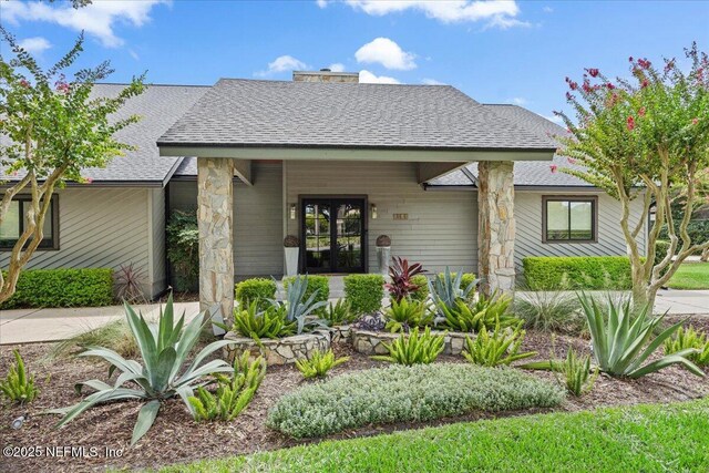 view of front of property with roof with shingles