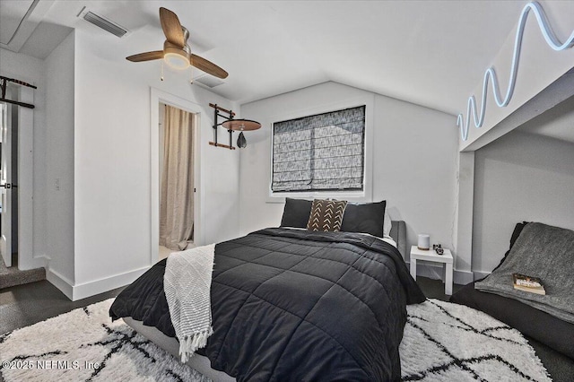 bedroom featuring baseboards, visible vents, a ceiling fan, and lofted ceiling