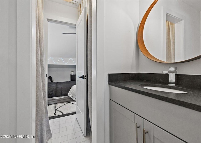 bathroom with tile patterned floors, vanity, and ensuite bathroom