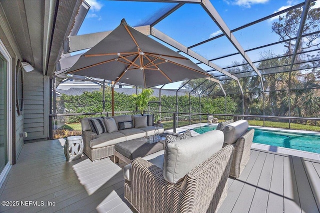 wooden terrace featuring an outdoor living space, an outdoor pool, and a lanai