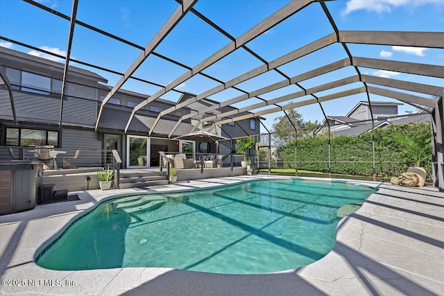 pool with glass enclosure and a patio area