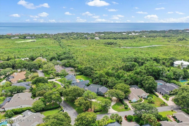 birds eye view of property featuring a water view and a residential view