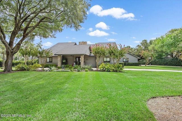 view of front of house featuring a front lawn and a chimney