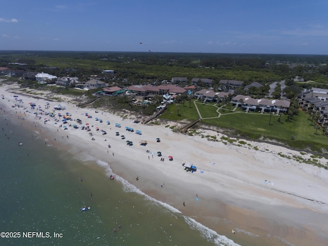 birds eye view of property with a view of the beach and a water view