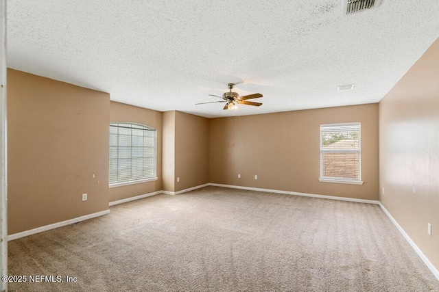 3925 Leatherwood Dr, Orange Park, FL 32065 - unfurnished room with a textured ceiling, a ceiling fan, carpet floors, and baseboards