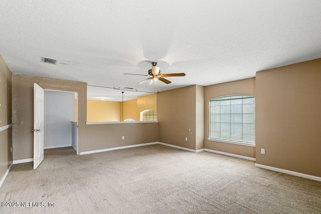 3925 Leatherwood Dr, Orange Park, FL 32065 - empty room with a ceiling fan, carpet flooring, a textured ceiling, and baseboards