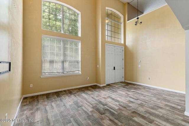 3925 Leatherwood Dr, Orange Park, FL 32065 - entrance foyer with a towering ceiling, wood finished floors, and baseboards