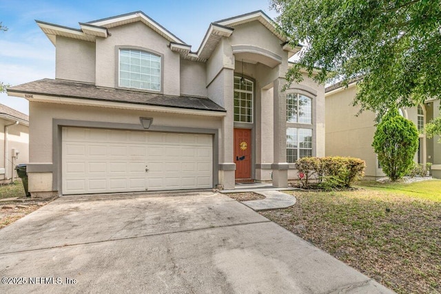 3925 Leatherwood Dr, Orange Park, FL 32065 - view of front of home featuring stucco siding, driveway, and a garage