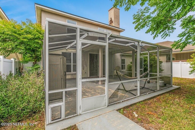 3925 Leatherwood Dr, Orange Park, FL 32065 - rear view of property with fence, a chimney, and a lanai