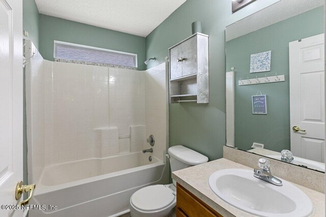 3925 Leatherwood Dr, Orange Park, FL 32065 - bathroom featuring toilet, a textured ceiling, vanity, and shower / tub combination
