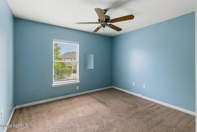 3925 Leatherwood Dr, Orange Park, FL 32065 - empty room featuring carpet flooring, ceiling fan, a textured ceiling, and baseboards