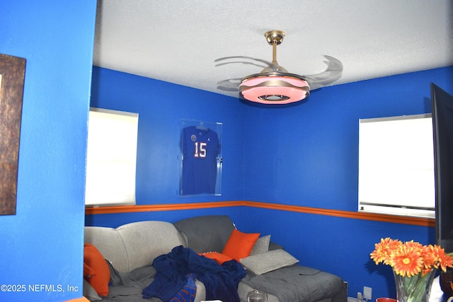 bedroom with multiple windows and a textured ceiling