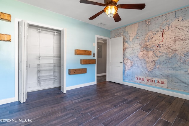 unfurnished bedroom featuring a closet, visible vents, ceiling fan, wood finished floors, and baseboards