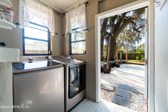 clothes washing area featuring laundry area and separate washer and dryer