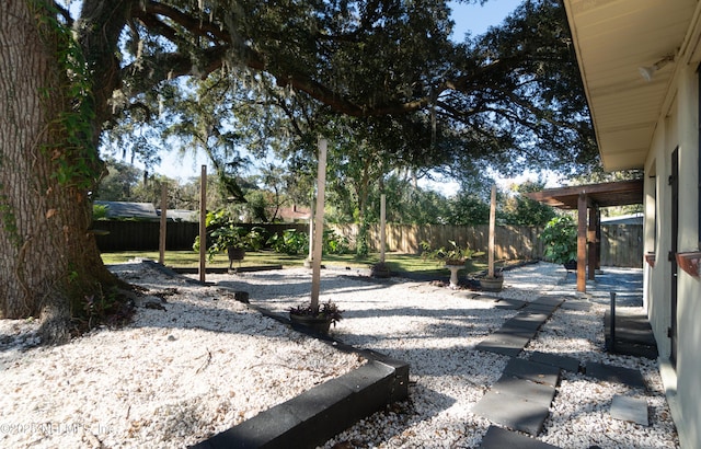 view of yard featuring a patio area and a fenced backyard