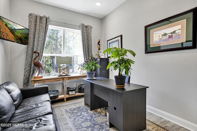 office area featuring baseboards and wood finished floors