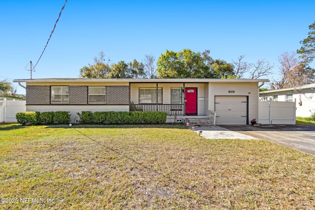 single story home featuring an attached garage, driveway, a front yard, and fence