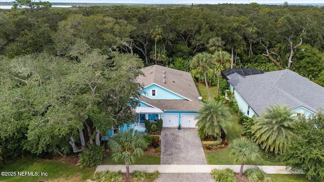 aerial view featuring a wooded view